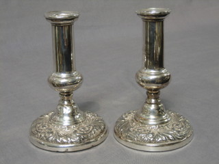 A pair of Georgian style stub silver plated candlesticks