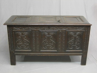 A 17th Century carved oak coffer of panelled construction with hinged lid, the interior marked 10 October 1650 IP 51"