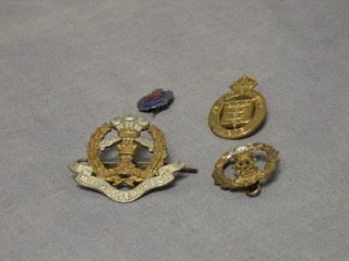 A George VI "silver" and enamelled Royal Engineers sweetheart's brooch, a 1950 service brooch, a Middlesex Regt. cap badge and ditto collar dog