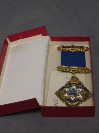A silver gilt and enamel President's breast jewel for the Provident Institution of Builders Foremen and Clerks of Work, the reversed engraved A T Bush
