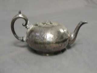 An engraved Britannia metal teapot