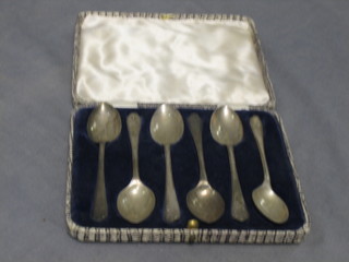 A set of 6 silver coffee spoons with golf emblems (crossed clubs) Sheffield 1933, 2 ozs
