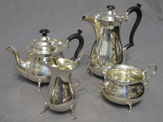 A 4 piece silver tea service with wavy cut border, with circular teapot, squat water jug, twin handled cream jug and sugar bowl, all raised on trifid feet, London 1938 and 1939, 52 ozs