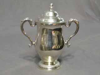 A Mappin & Webb silver cup and cover of baluster form and raised on a circular spreading foot, London 1918 16 ozs