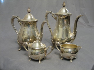 A modern 4 piece silver plated coffee service comprising coffee pot, hotwater jug, twin handled sugar bowl and cover and a cream jug