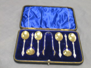A set of 6 silver apostle coffee spoons with matching tongs and silver gilt bowls, Sheffield 1902, 3 ozs, cased