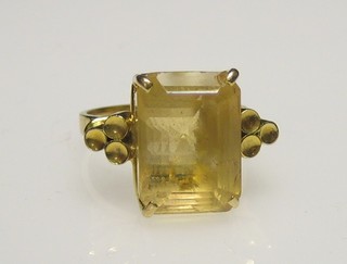 A lady's 18ct gold dress ring set a rectangular smokey quartz stone
