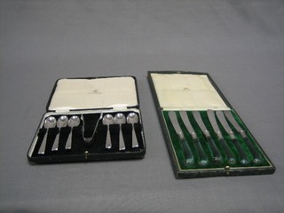 A set of 6 silver plated tea knives with glass pistol grip handles (3f), cased and a set of 6 Art Deco silver plated coffee spoons and tongs, cased