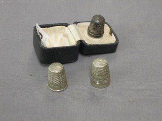 A silver thimble and 2 others