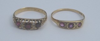 A lady's 18ct gold dress ring set 3 pink stones and 1 other dress ring