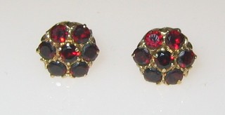 A pair of gold and garnet cluster ear studs