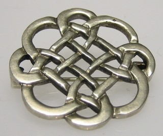A silver Celtic knot brooch