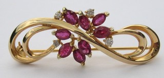 A 14ct gold bar brooch set rubies and diamonds