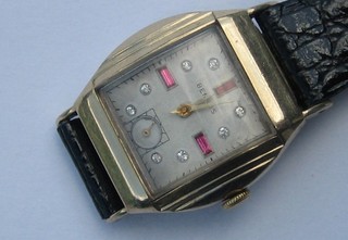 A gentleman's Art Deco style wristwatch by Benrus with silver dial set hardstones contained in a gold plated case