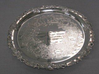 A circular engraved silver plated salver 13" with pierced and cast border