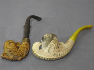 2 carved Meerschaum pipes in the form of claws