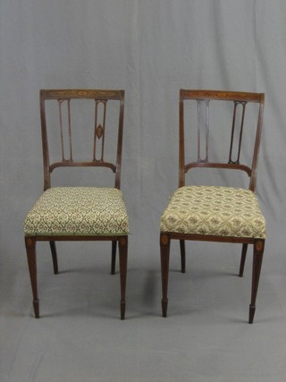 A pair of Edwardian inlaid mahogany stick and bar back bedroom chairs (back with some damage)