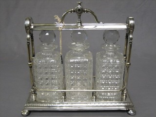An Edwardian Staniforth's patent silver plated tantalus frame with 3 cut glass spirit decanters (1f)