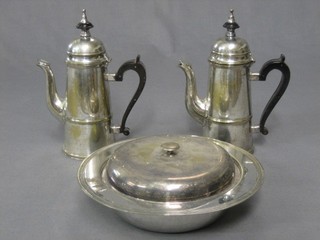 A circular silver plated muffin dish and 2 Queen Anne style silver plated coffee pots