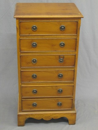 A Georgian style yew pedestal chest with crossbanded top fitted 6 long drawers, raised on bracket feet 17"