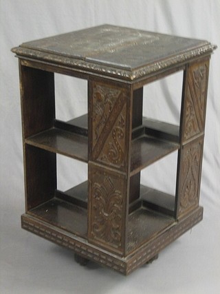 A carved oak square revolving bookcase 32"