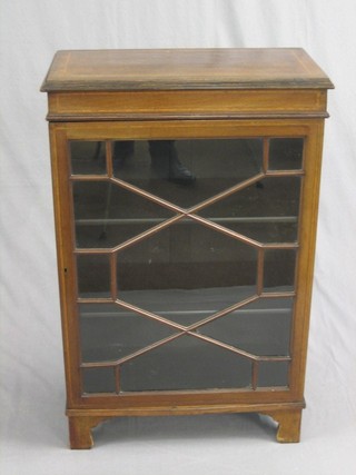 An Edwardian Georgian style inlaid mahogany display cabinet, the interior fitted adjustable shelves enclosed by astragal glazed panelled doors, raised on bracket feet 24"