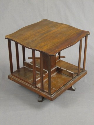 An Edwardian square mahogany revolving table top bookcase 15"