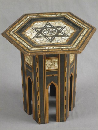 An octagonal Moorish table, the top inlaid a star and mother of pearl throughout, 15"