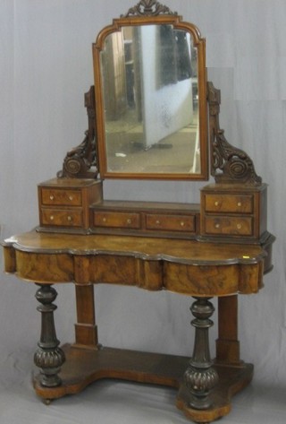 A Victorian figured walnut Duchess dressing table with arch shaped mirror above 6 glove drawers, the base fitted a drawer and raised on turned supports 48"