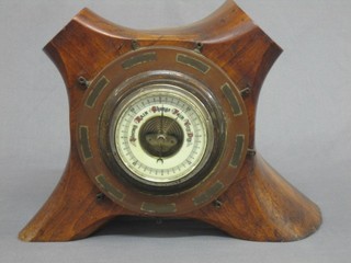 A 1930's aneroid barometer mounted in a wooden 4 bladed propeller boss 12"