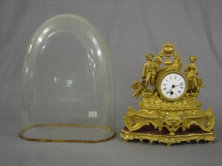 A 19th Century French 8 day mantel clock contained in a gilt spelter case supported by a figure of gallant and belle, complete with glass dome
