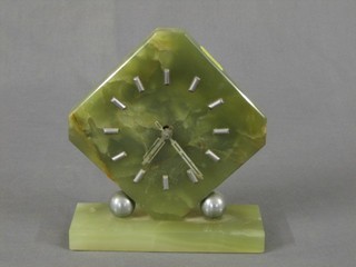 A 1930's Art Deco mantel clock contained in an octagonal green onyx case 6"