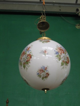 A large glass ball light shade with floral decoration 