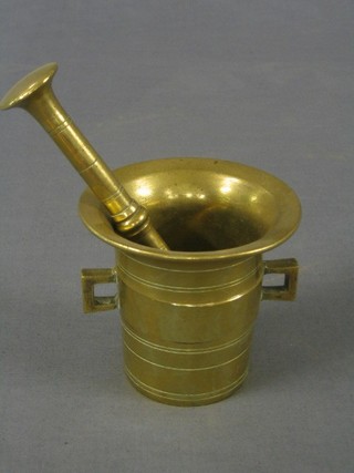 An brass mortar and pestle