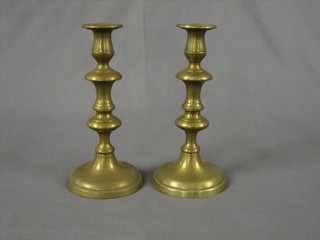A pair of 19th Century brass candlesticks with ejectors 12"