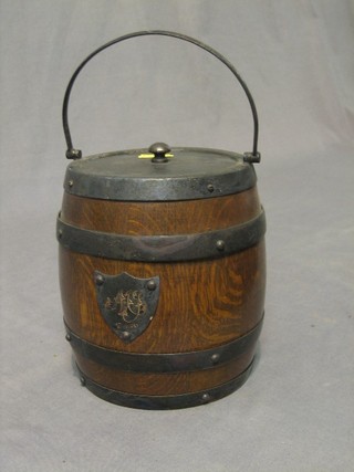 An oak and silver plated biscuit barrel