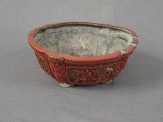 A 19th Century Oriental lacquered redware planter, raised on bracket feet (some damage)