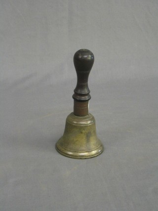 A 19th Century brass handbell with turned wooden handle 6"