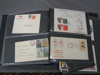 A blue album containing various First Day Covers 1963 - 1982