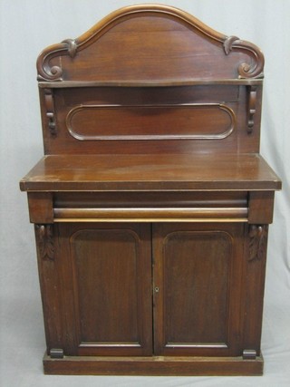 A Victorian mahogany chiffonier with raised back, the base fitted 1 long drawer above a double cupboard, raised on a platform base 34" (crack to top and some veneers missing)