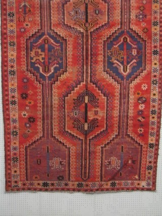 A contemporary Kurdish pink ground rug with geometric design to the centre 113" x 58"