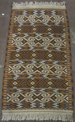 A black and brown ground Kelim rug 76" x 42"