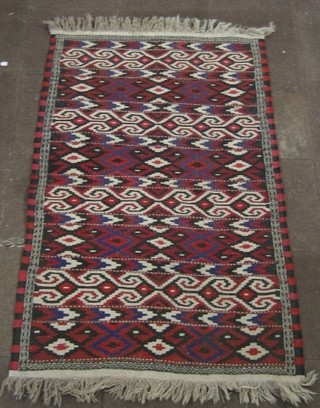 A black and red ground Kelim rug 73" x 48"