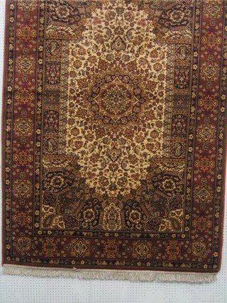 A rose coloured Persian design Belgian carpet 91" x 59"