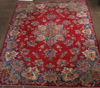 A contemporary red ground Persian carpet with central medallion 147" x 120" 