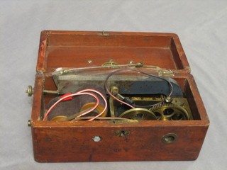 A Victorian electric shock machine contained in a mahogany case