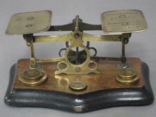 A pair of 19th Century brass and mahogany letter scales with weights