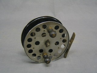 A polished steel and brass sea reel 4"