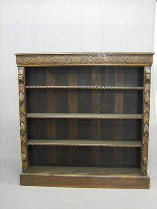 A Victorian carved oak bookcase, the interior fitted adjustable shelves, raised on a platform base 48"