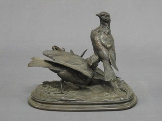 J Moigniuz, a bronze figure of 2 standing birds, raised on an oval naturalistic base 10" (standing bird f and r)